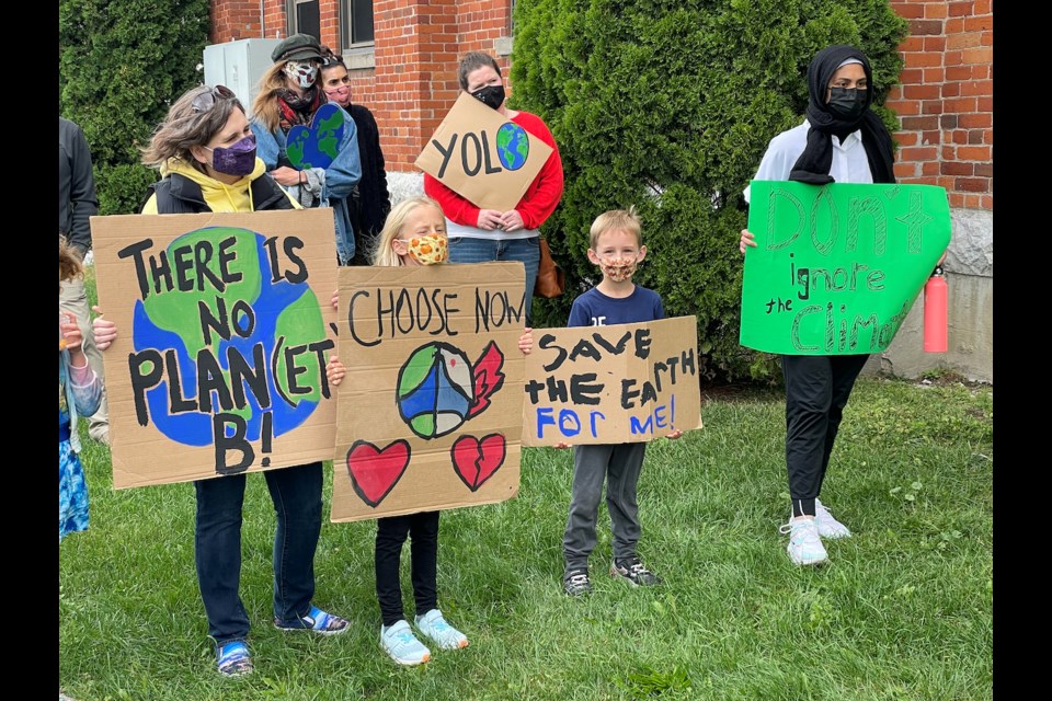 About 30 people gathered outside the Orillia City Centre on Friday afternoon to urge the City of Orillia to set ambitious science-based targets for the climate change action plan. They paraded through the downtown to spread their message.