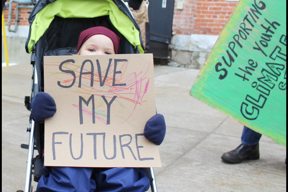 Two-year-old Bronwyn King took part in a climate strike Friday outside the Orillia City Centre. Nathan Taylor/OrilliaMatters