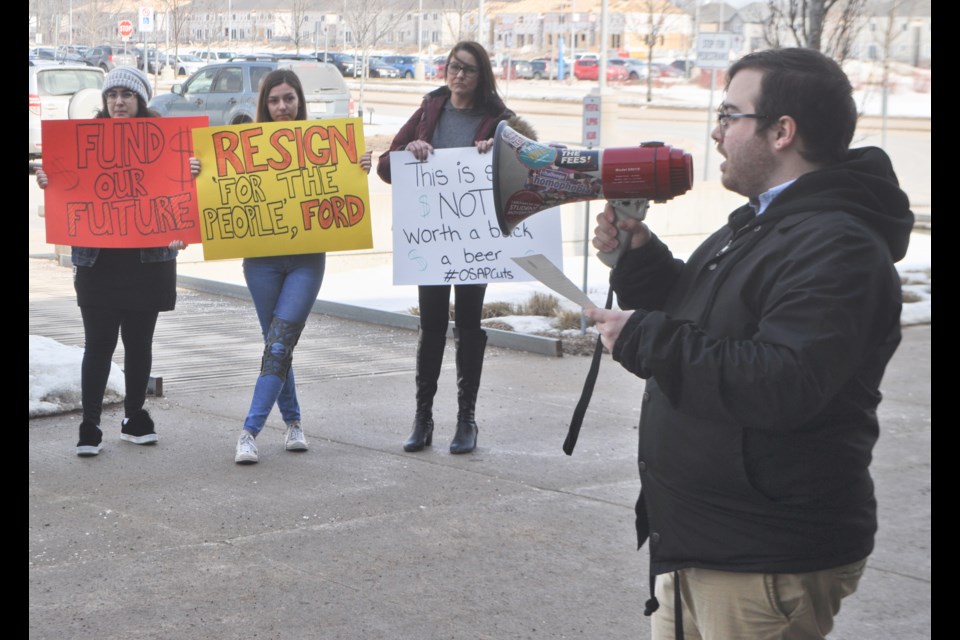 Brandon Rhéal Amyot, of the Lakehead University Student Union, led students in a noon-hour demonstration Wednesday at the Orillia campus to protest provincial government funding cuts. Andrew Philips/OrilliaMatters