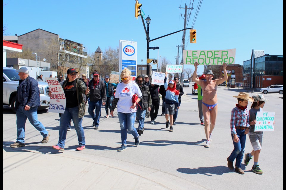 Anti-lockdown protesters are shown Friday at Colborne and West streets.