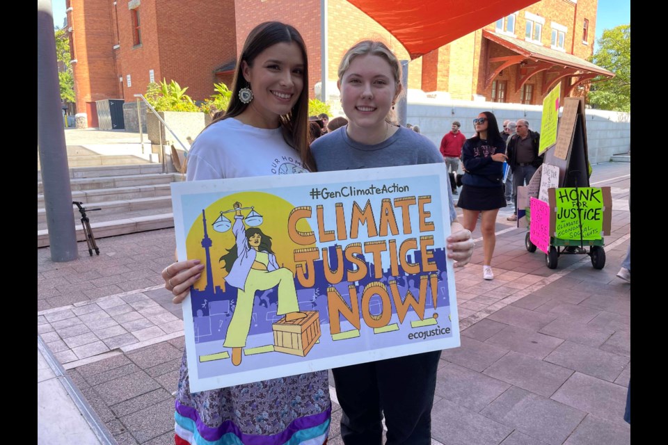 Shaelyn Wabegijig, left, and Kate Sontag, right, led Friday's Global March to End Fossil Fuels in downtown Orillia. 