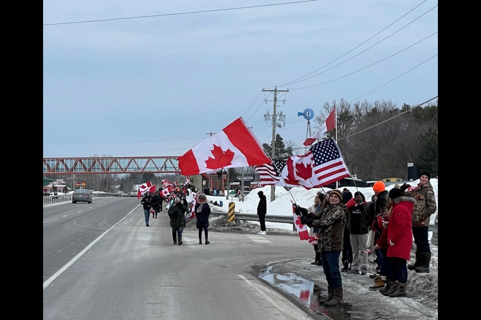 More than 600 people stood along Highway 11 on Saturday afternoon to form a 'Freedom Line.'