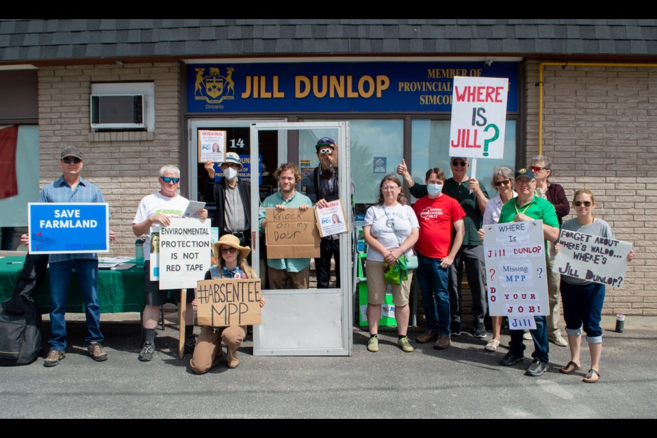 People gathered in front of Jill Dunlop's Orillia office Saturday morning. They expressed their frustration with the MPP skipping debates and ignoring constituents.
