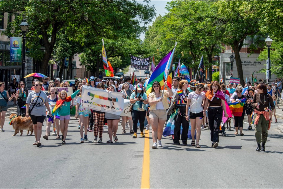 People parade through downtown Orillia on Saturday afternoon as part of the Pride March.