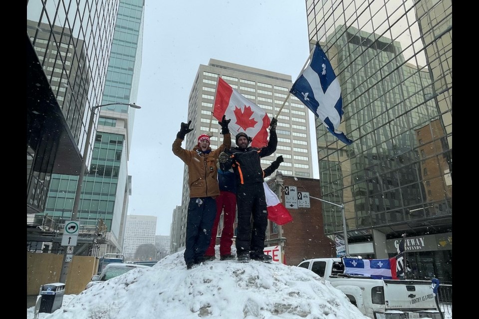 These protesters found the high ground of sorts in downtown Ottawa and used it to wave their flags proudly. 