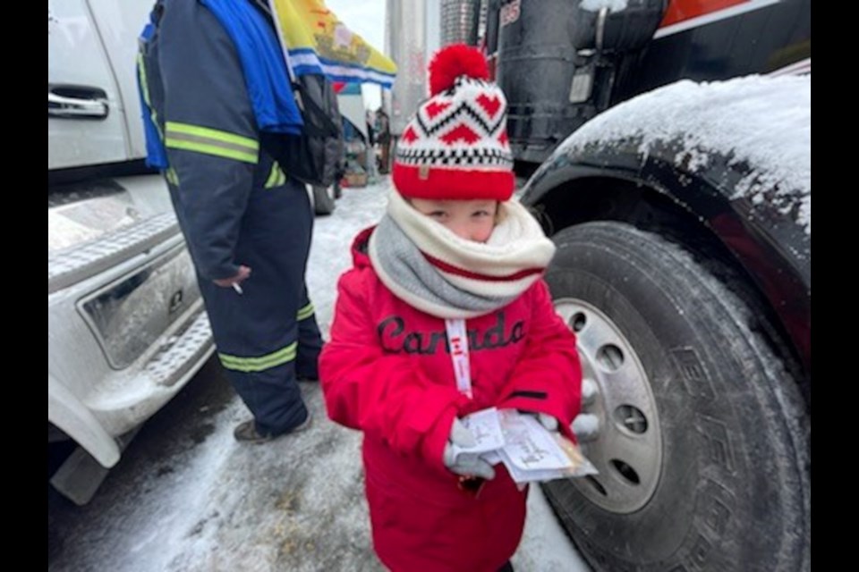 Summer Hilliard, 6, handed out homemade cookies and hand-made cards to truckers Saturday at the demonstration at Parliament Hill.