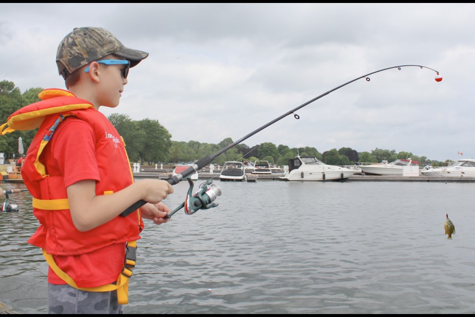 It only took a few minutes for Orillia's Logan Thomson, 8, to get his first bite during Tuesday's Learn to Fish event at the Port of Orillia. Nathan Taylor/OrilliaMatters