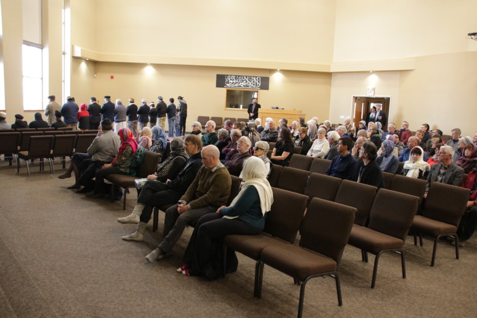 Attendees at a vigil Saturday to remember the victims of the deadly shooting at mosques in New Zealand watch as people pray at the Maryam Mosque in Oro-Medonte. Mehreen Shahid/OrilliaMatters