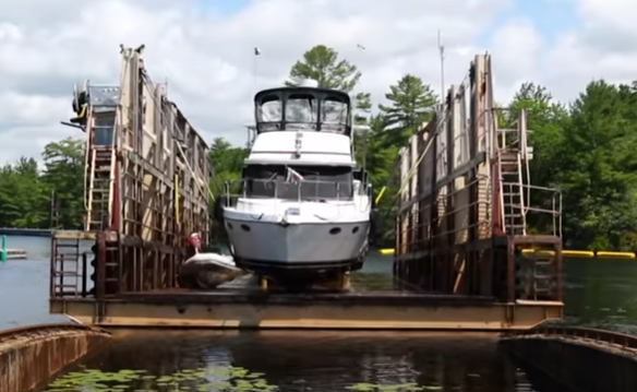 A boat makes the vogage over Canadian Shield to the lake below thanks to the iconic Big Chute Marine Railway, one of the locks on the Trent-Severn Waterway, which is a national historic site.