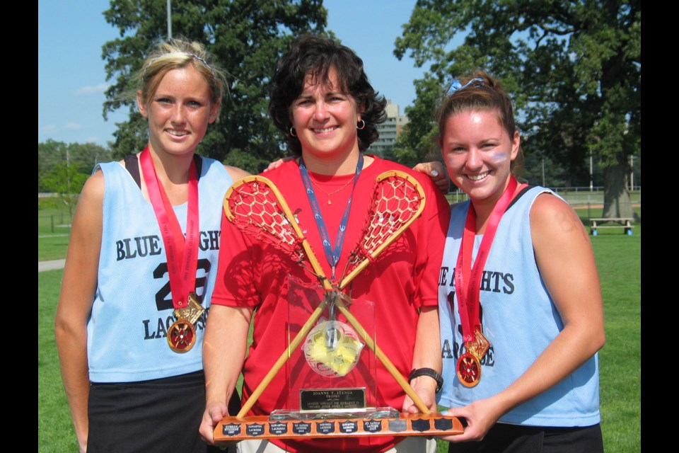 Joanne Stanga presents the award named in her honour to the provincial champs in 2004. Stanga, a women's lacrosse pioneer, will be inducted into Orillia's Sports Hall of Fame May 28.