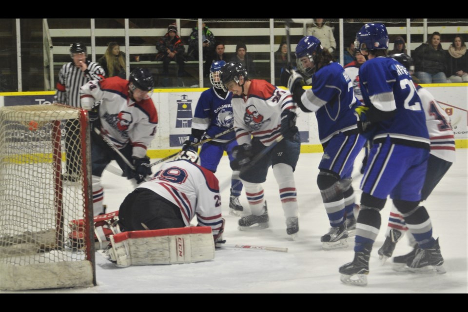 Bracebridge goalie Jamie Gee covers the puck during a recent clash with Coldwater. Leslie Robson/Bella Mia Photography.