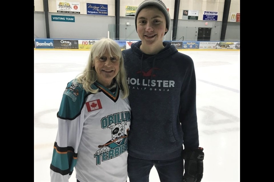 Gail Duck is shown with one of her on-ice assistants, Carter Metcalf, at the conclusion of the Mighty Mytes graduation game. Duck is retiring after 24 years of heading up the program. Supplied photo