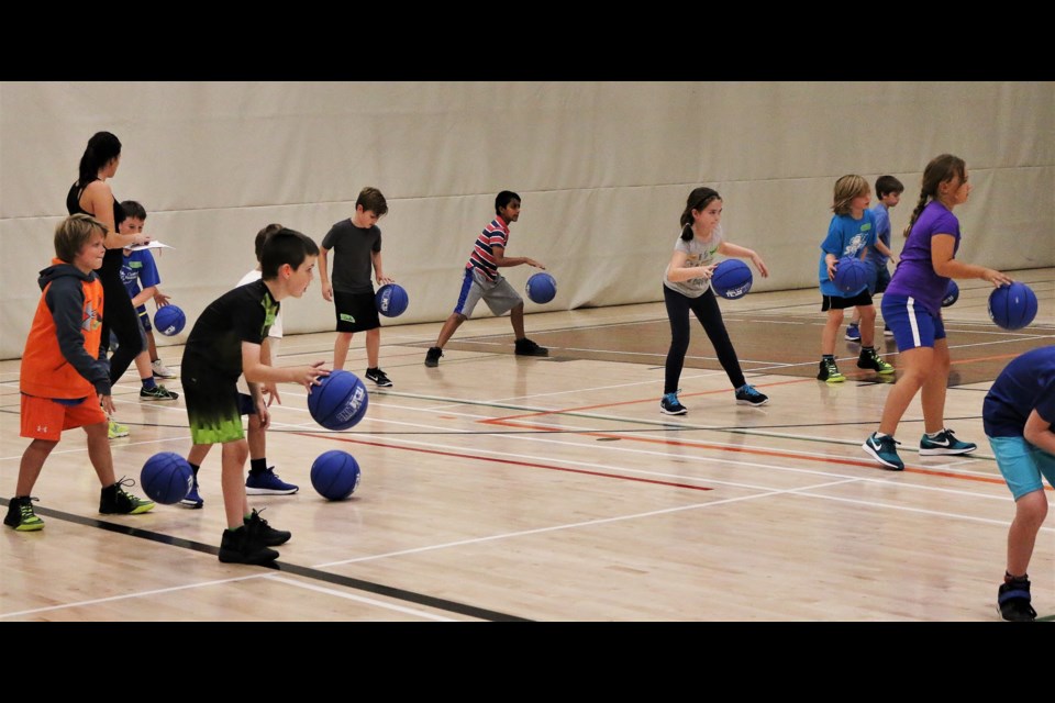 Boys and girls in grades 1 and 2 learn the fundamentals of basketball – with a smaller basketball – as part of the Orillia Youth Basketball Association’s Junior Lakers program. Supplied photo