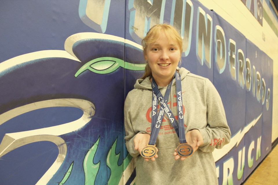 Brittney Yurek shows off the gold and bronze medals she won at the recent OFSAA track and field championships. Nathan Taylor/OrilliaMatters