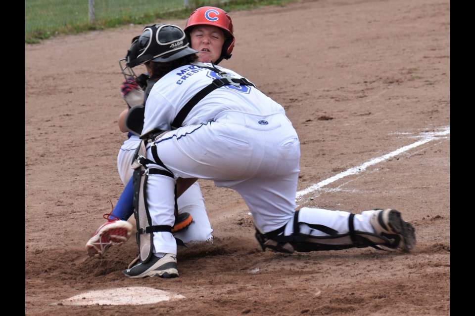Orillia Meridian Credit Union peewee Royals catcher Will Timpano blocks the plate and makes the tag, stopping this Cambridge runner from scoring during first-inning action Saturday at Kitchener Park. Dave Dawson/OrilliaMatters