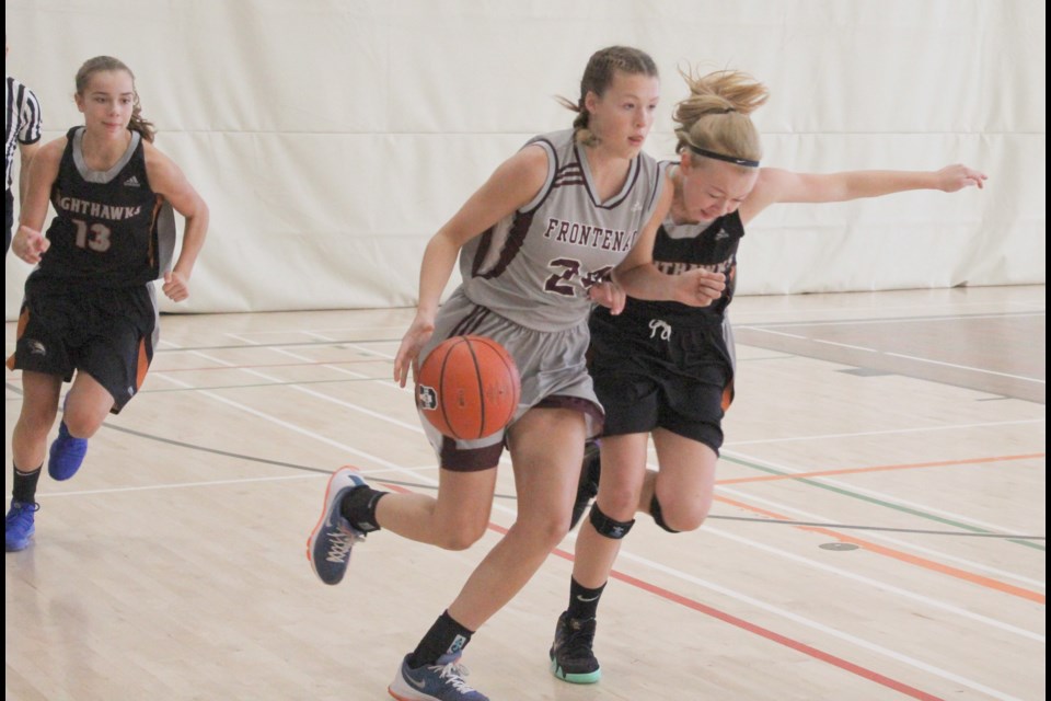 A Frontenac Falcon tries to get past a couple of Nighthawks during Saturday's Blackball Classic junior final. Nathan Taylor/OrilliaMatters