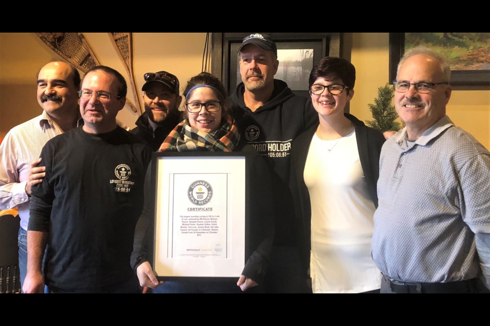 This group put their names in the Guinness Book of World Records thanks to their 105-plus hour curling marathon last year in Colddwater. From left: John Carpino, Calvin Manley, Stephen Collins, Amanda Pearce, Bill Pearce, Brittany Pearce and Terry Lee. Absent: Michael Foster, Lauren Grealy and Jeremy Rand.
