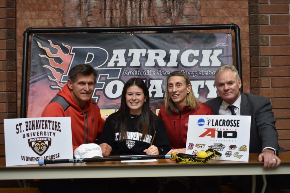 Jerica Obee officially signs her letter of intent to play Division 1 women's field lacrosse at Bonaventure University in New York. From left, Hank Ilesic (trainer), Obee, Barb Boyes (coach with Edge lacrosse) and Pat Morris (coach). Dave Dawson/OrilliaMatters
