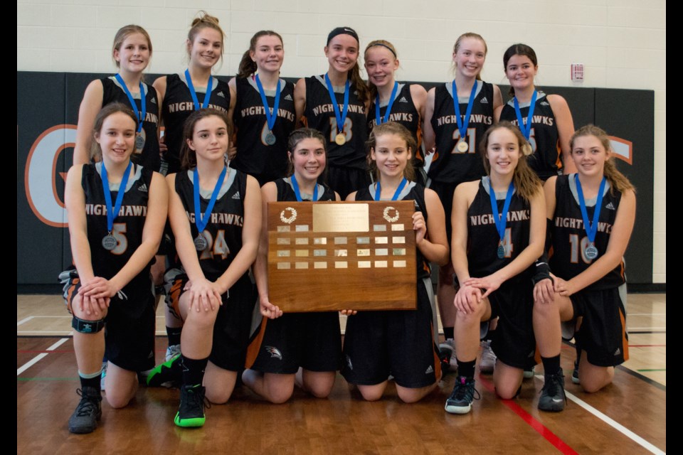 The Orillia Secondary School Nighthawks junior girls' basketball team trounced their Barrie rival 81-25 to win the Georgian Bay championship Tuesday. After the win, they posed with the coveted GBSSA plaque. Tyler Evans/OrilliaMatters
