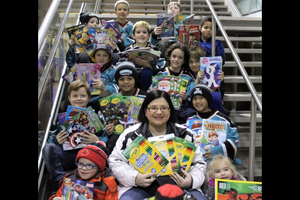 Angie Green-Hill decided to try to collect 500 colouring books and 500 packages of crayons for less fortunate kids this year. Members of the Julie Emery minor atom Terriers embraced the idea and recently donated 93 colouring books and 80 packs of crayons.