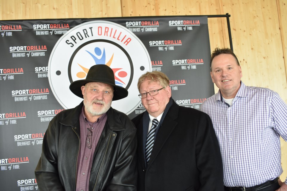 From left: Thom McGill, representing his late father, Bill McGill, Don Stoutt and Stuart Burnie were unveiled Tuesday as the latest inductees into Orillia's Sports Hall of Fame. Dave Dawson/OrilliaMatters