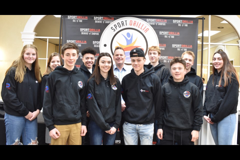 Hard-working student athletes from Orillia Secondary School, Twin Lakes Secondary School and Patrick Fogarty Catholic Secondary School were recognized Thursday morning at the fifth annual Breakfast of Champions event hosted by Sport Orillia. With the students is Stu Burnie, who will be inducted into the Orillia Sports Hall of Fame Saturday night. Dave Dawson/OrilliaMatters