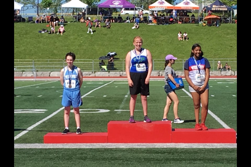 Twin Lakes Secondary School student Brittney Yurek, centre, won gold in the 100-metre dash at the recent Ontario Federation of School Athletic Associations meet in Guelph. Supplied photo