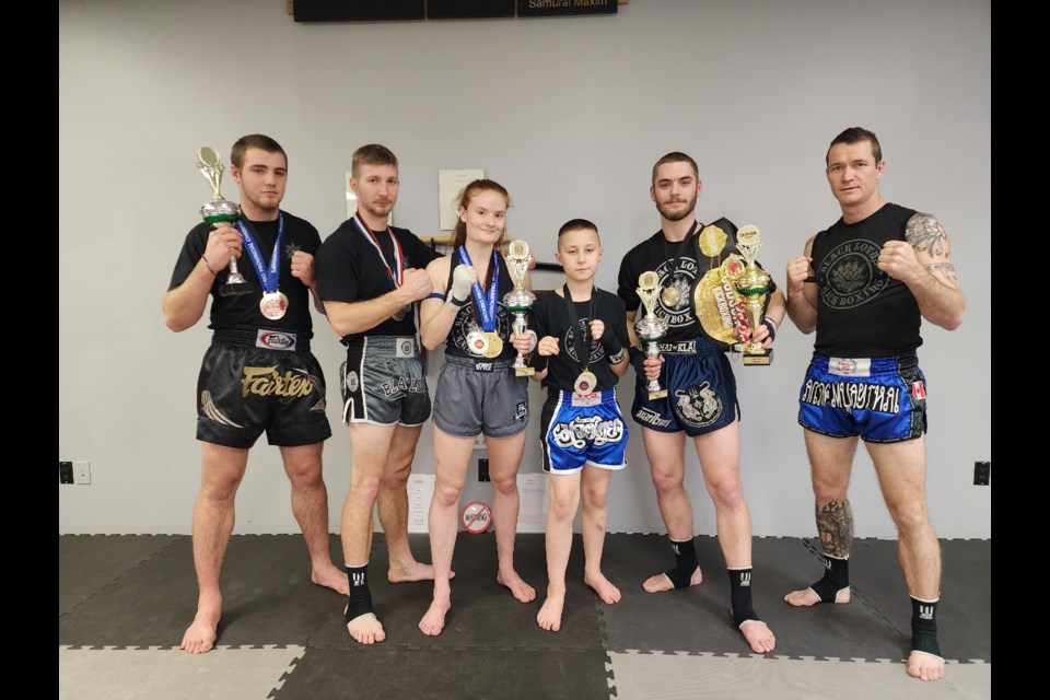 Pictured, from left, are Black Lotus Kickboxing Academy athletes Noah Redmond (national champion, provincial bronze medallist), Kai Clement, McKenna Van Allen (provincial champion), Kayne Lawrence (gold in the under-12 division), Dustin Cronk (Durham kickboxing championship title holder) and Nic Langman (head coach).