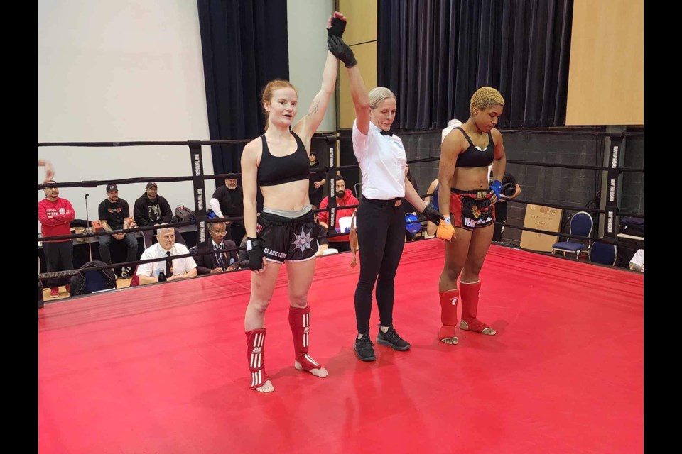 McKenna "Tiger Girl" Van Allen, left, won women's open class gold at the WAKO Kickboxing provincial championships.