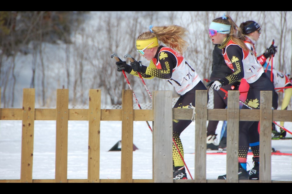 Future Twin Lakes Secondary School skier Anna Vurma and Elle Waite tag off in the team sprint finals.