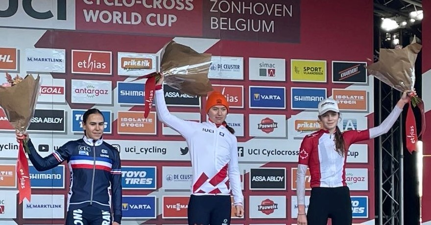 Orillia's Ava Holmgren, right, celebrates her first podium finish at a World Cup race, finishing third in the event  in Belgium that featured the world's top cyclocross athletes.