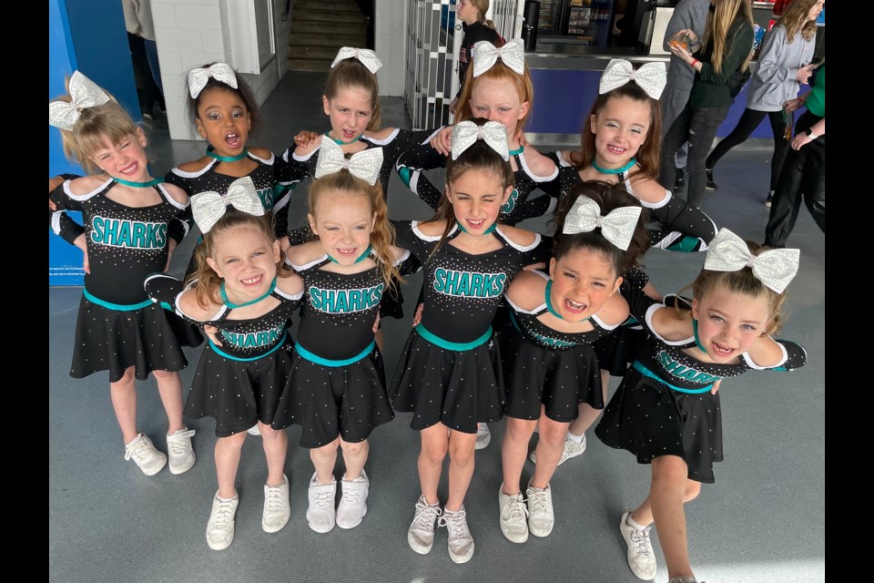 The Baby Blue Sharks. In the back row: Maggie McConnell, Shanley Charlery, Natalie Calow, Adalynn Boyd and Annorah Edmunds. In the front row: Makynlee Lyons, Adelyn Bartlett, Talia Guerrera, Charleigh Grant and Ellia Middleton.