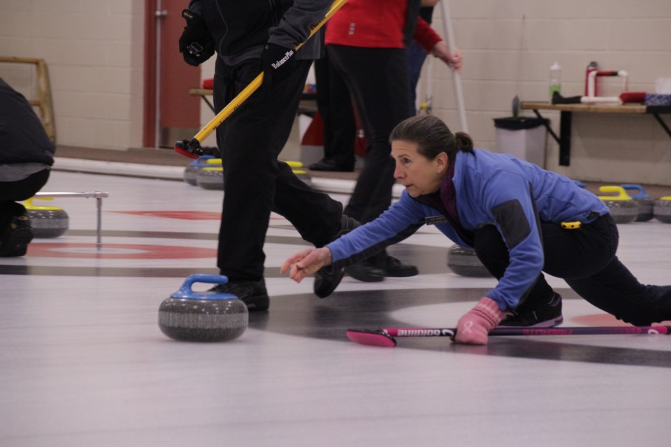 Ildi Connor, of Orillia, throws a stone during Saturday's mixed doubles curling bonspiel at the Barnfield Point Recreation Centre. Mehreen Shahid/OrilliaMatters