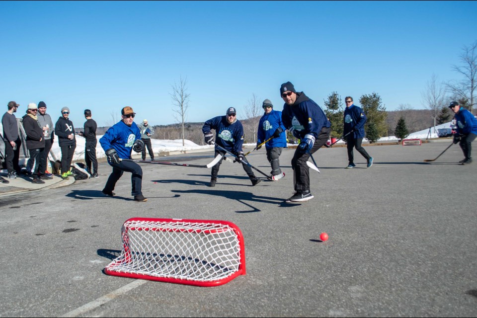 Team OrilliaMatters (light blue) took on The Zambonis (dark blue) in ball hockey action during the Braestone Winter Classic on Saturday.