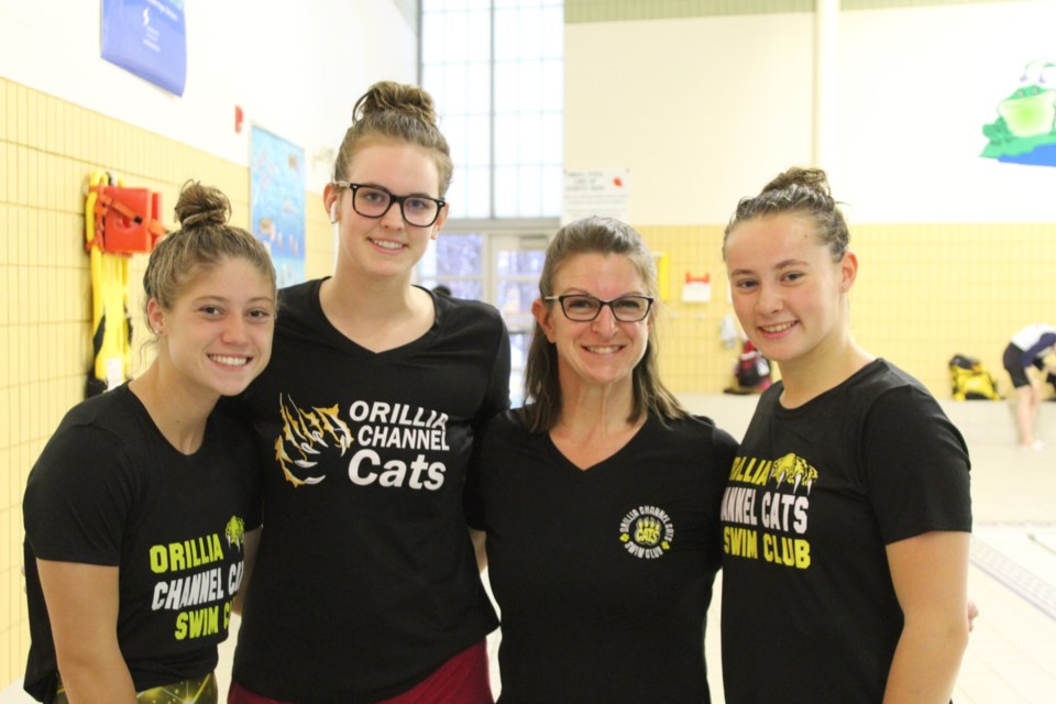 Coach Meredith Thompson-Edwards with graduating swimmers Chloe Smith,  Holly McCool and Chilyn Fenton. Contributed Photo