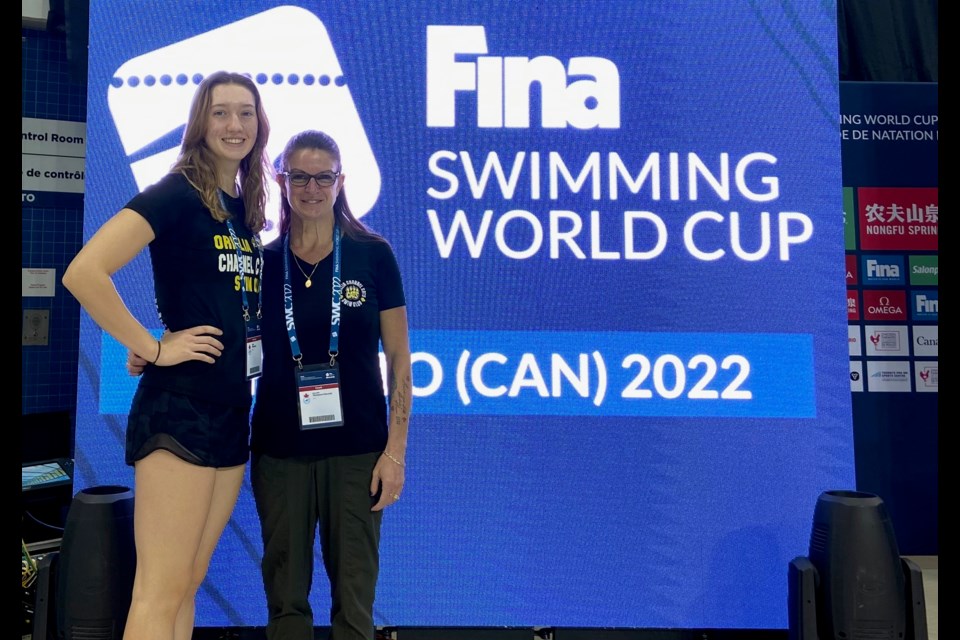 Orillia Channel Cats swimmer Blythe Wieclawek, left, is shown with head coach Meredith Thompson-Edwards after competing at the FINA World short course championships held in Toronto.