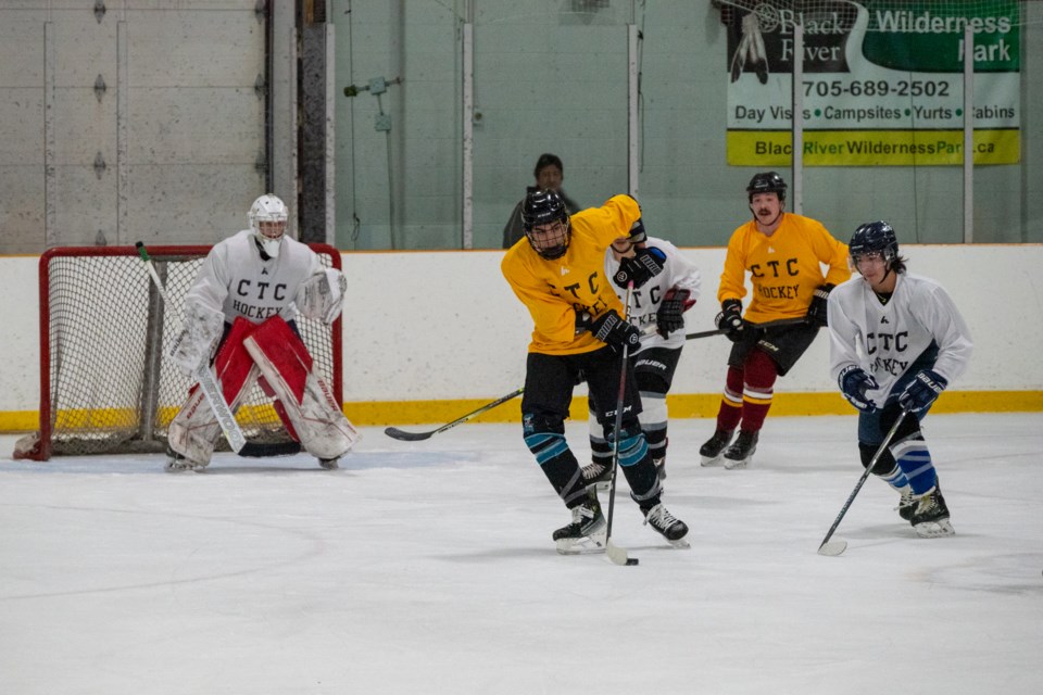 Team Yellow looks for a scoring opportunity Saturday against Team White during the Chippewa Tri-Council Hockey Day tournament at the Mnjikaning Arena Sports Ki.
