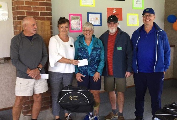 The winning team at Wednesday's Open Triples event was skip Lynn Smith, Gord Murphy and Barry Holloday, who are shown receiving their prizes from Leah Cavannah. Drawmaster Rick Swinton is on the far left.