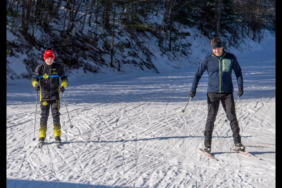Mason Charles, left, and his father, Trevor, were Nordic skiing at Hardwood Ski and Bike on Saturday afternoon.