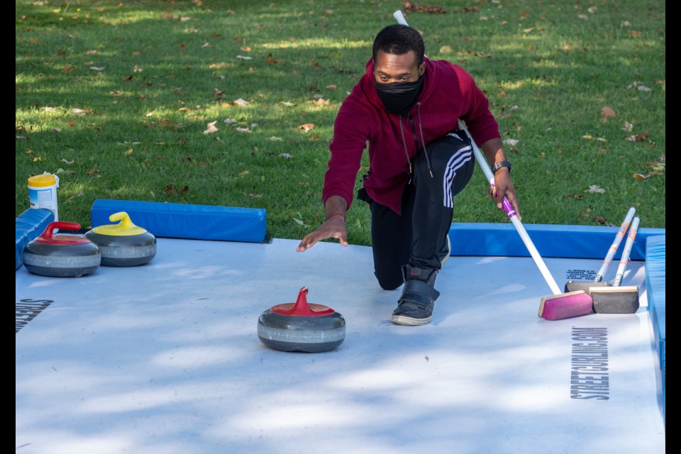 Lakehead University student James Gibbs attended the Barnfield Point Recreation Centre on Saturday to get information about the upcoming Orillia Curling Club season. There was a 'rink' set up outside for people to give the sport a try. 