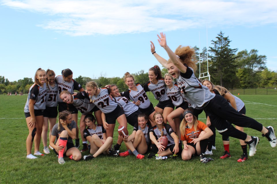 Jessica Goodwin,  shown leaping to the right, with her flag football team, was the winner of Orillia Secondary School's (OSS) highest athletic honour - the Legends of OSS Award. Contributed photo
