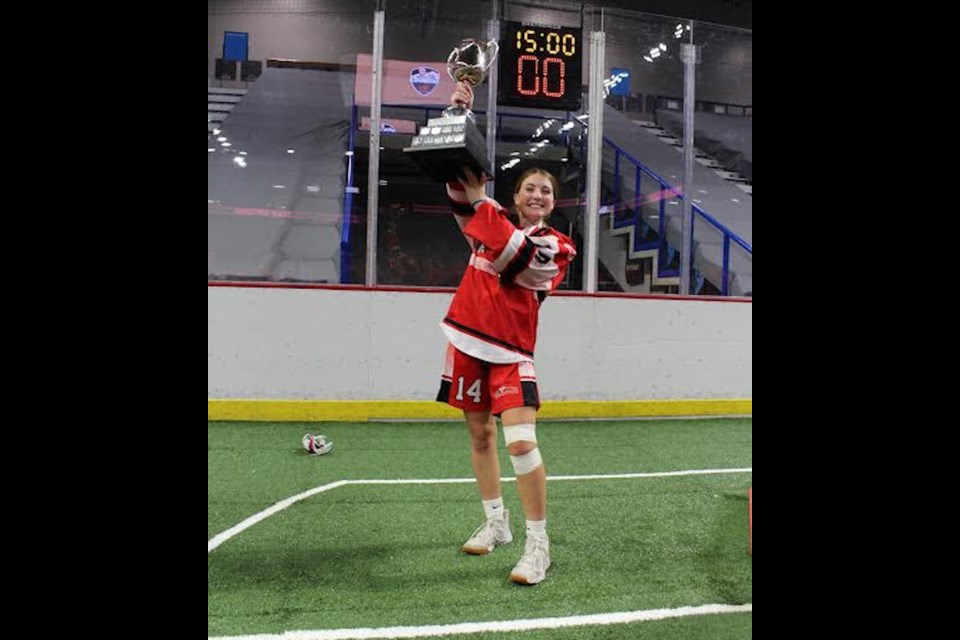 Ryley Black poses with the U15 national championship after being on the victorious side of a 5-2 victory for Team Ontario over Team B.C. on Sunday.