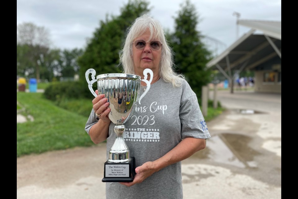 Steve Makins's mother, Cheryl Stubbings, is pictured with the Makins Cup.
