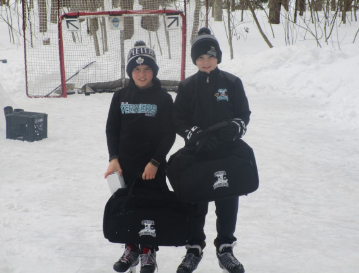 Brothers Trent Willison, left, and Tyson pose on their home rink where they posted 5,733 and 6,923 shots respectively, over the four-week challenge.