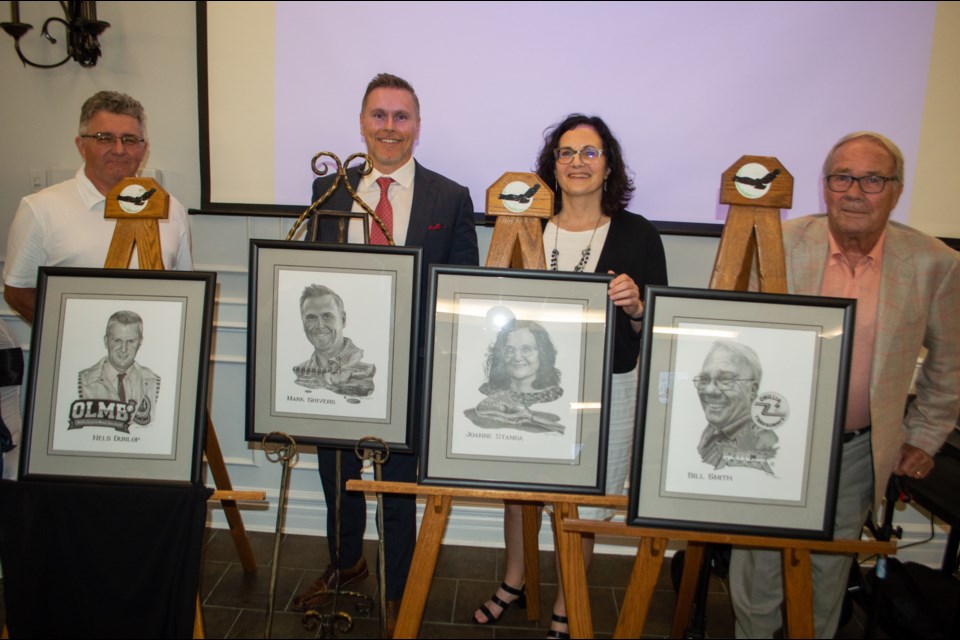 The Orillia Sports Hall of Fame class of 2021 was inducted on Saturday night. From left are inductees Mick Dunlop (on behalf of his late father, Nelson Dunlop), Mark Shivers, Joanne Stanga, and Bill Smith. 