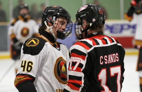 Orillia Terrier Caleb Sands has an animated conversation with Innisfil's Caleb Tiffin-Seminara during heated action Saturday night at Brian Orser Arena. Orillia won the contest 7-4.
