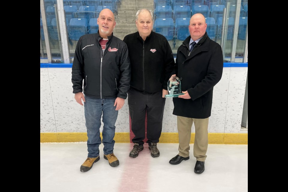 Terriers head coach Dalyn Telford was named coach of the year for the PJHL's North Carruthers Division before Game 5 on Tuesday night. From left are Terriers president Andrew McDonald, PJHL North Conference manager Doug Kennedy and Telford.