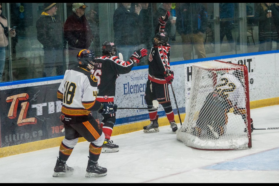Orillia Terriers' captain Dylan Palomaki plays to the crowd after scoring the first goal of Game 2 Saturday night. The Terriers defeated the Innisfil Spartans 4-2 at Rotary Place, tying the first round Provincial Junior Hockey League series at one game a piece.  