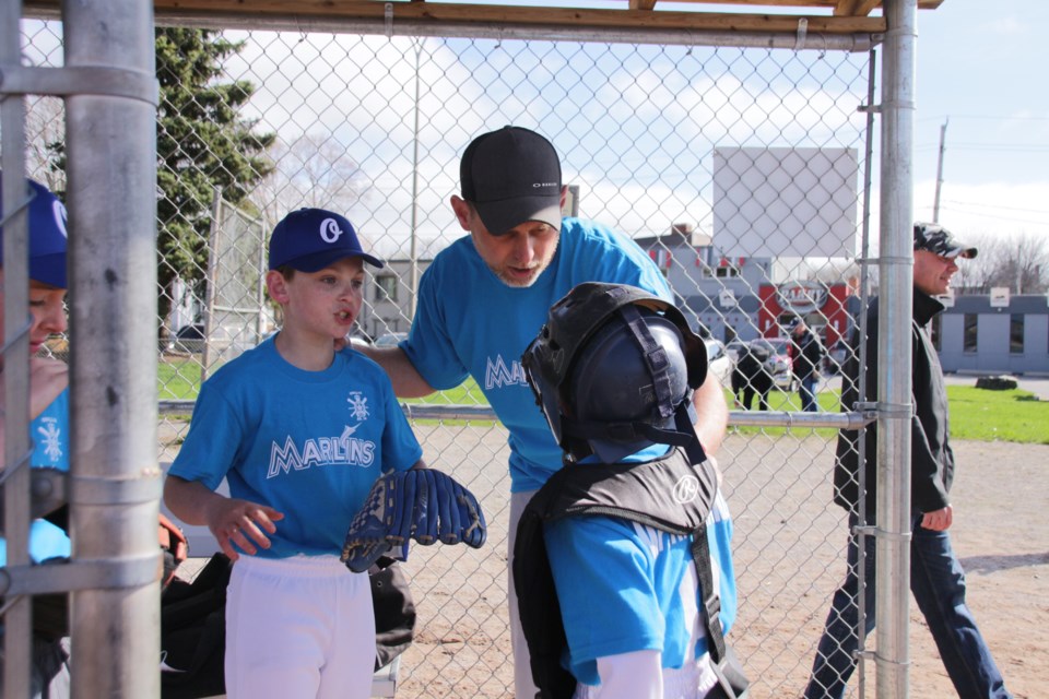 Mr. Appliance Marlins coach Marlo MacInnis gives instructions to his players as Orillia Legion Minor Baseball celebrated opening day of a new season Saturday at McKinnell Park. Mehreen Shahid/OrilliaMatters