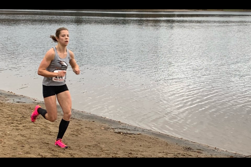 Orillia Secondary School student Audrey Reickenburg runs along the water at Arrowhead Park en route to qualifying for OFSAA. Contributed photo